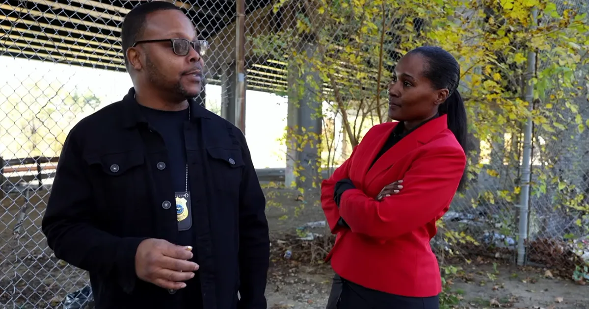 two detectives discussing a case from the movie trust not